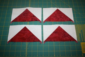 Four quick pieced Flying Geese Units.